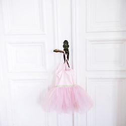 Pink tutu hanging on door handle