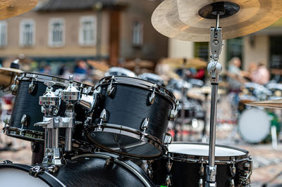 A set of plates in a drum set. at a concert of percussion music, selective focus, close-up