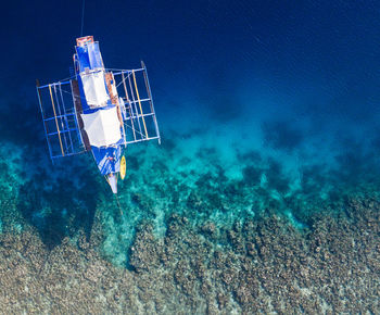 High angle view of boat sailing in sea