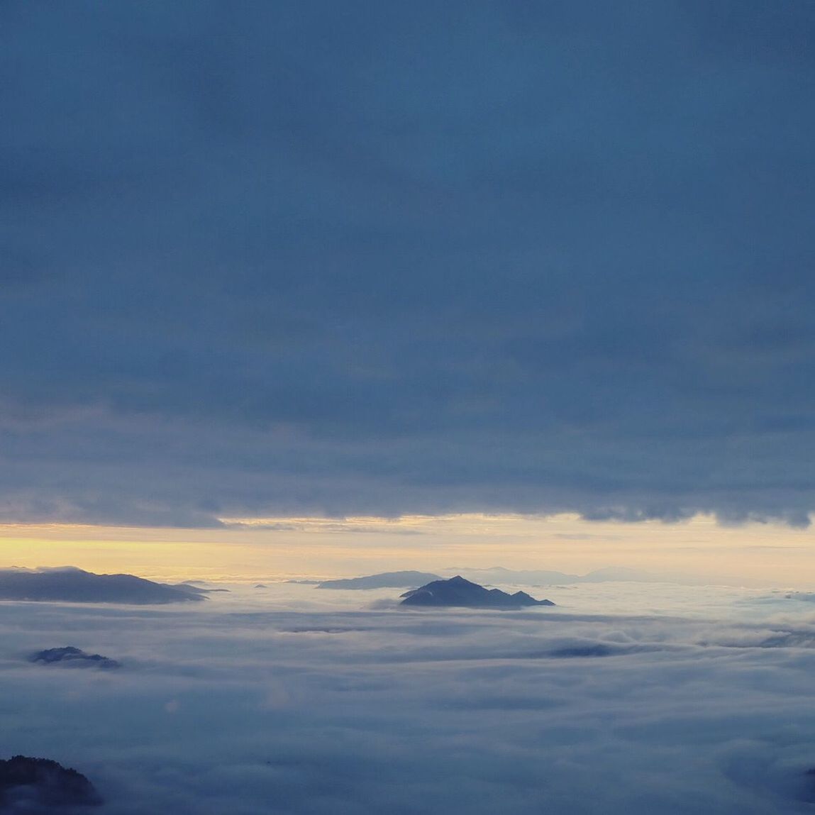 sky, cloud - sky, scenics - nature, beauty in nature, tranquility, tranquil scene, no people, nature, sunset, idyllic, mountain, outdoors, environment, cloudscape, copy space, non-urban scene, landscape, day, travel, above, mountain peak