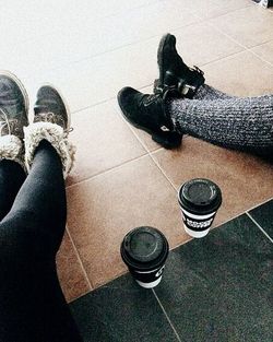 Low section of woman wearing shoes