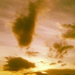 Low angle view of cloudy sky at sunset