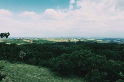 Scenic view of landscape against cloudy sky