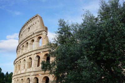 Low angle view of colosseum against sky