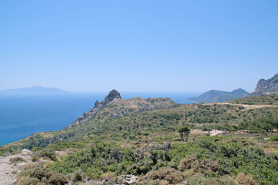 Scenic view of mountains against clear blue sky