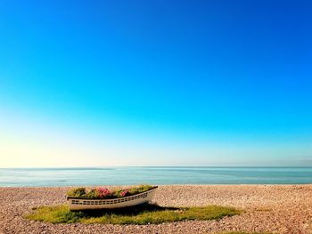 Scenic view of sea against clear blue sky