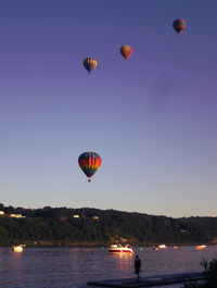 Hot air balloon flying over sea