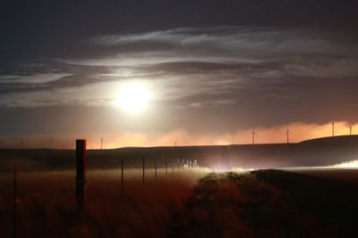 Scenic view of landscape against sky at night