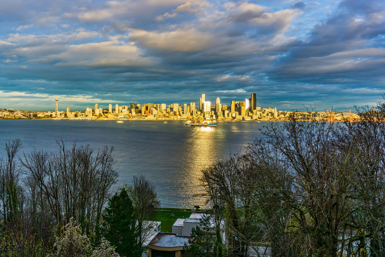 sky, water, architecture, cloud, nature, built structure, morning, travel destinations, horizon, plant, dusk, reflection, city, building exterior, no people, tree, travel, sea, landscape, building, beauty in nature, tourism, shore, scenics - nature, outdoors, coast, environment, land, cityscape, bridge, sunlight, transportation, tranquility, urban skyline, beach