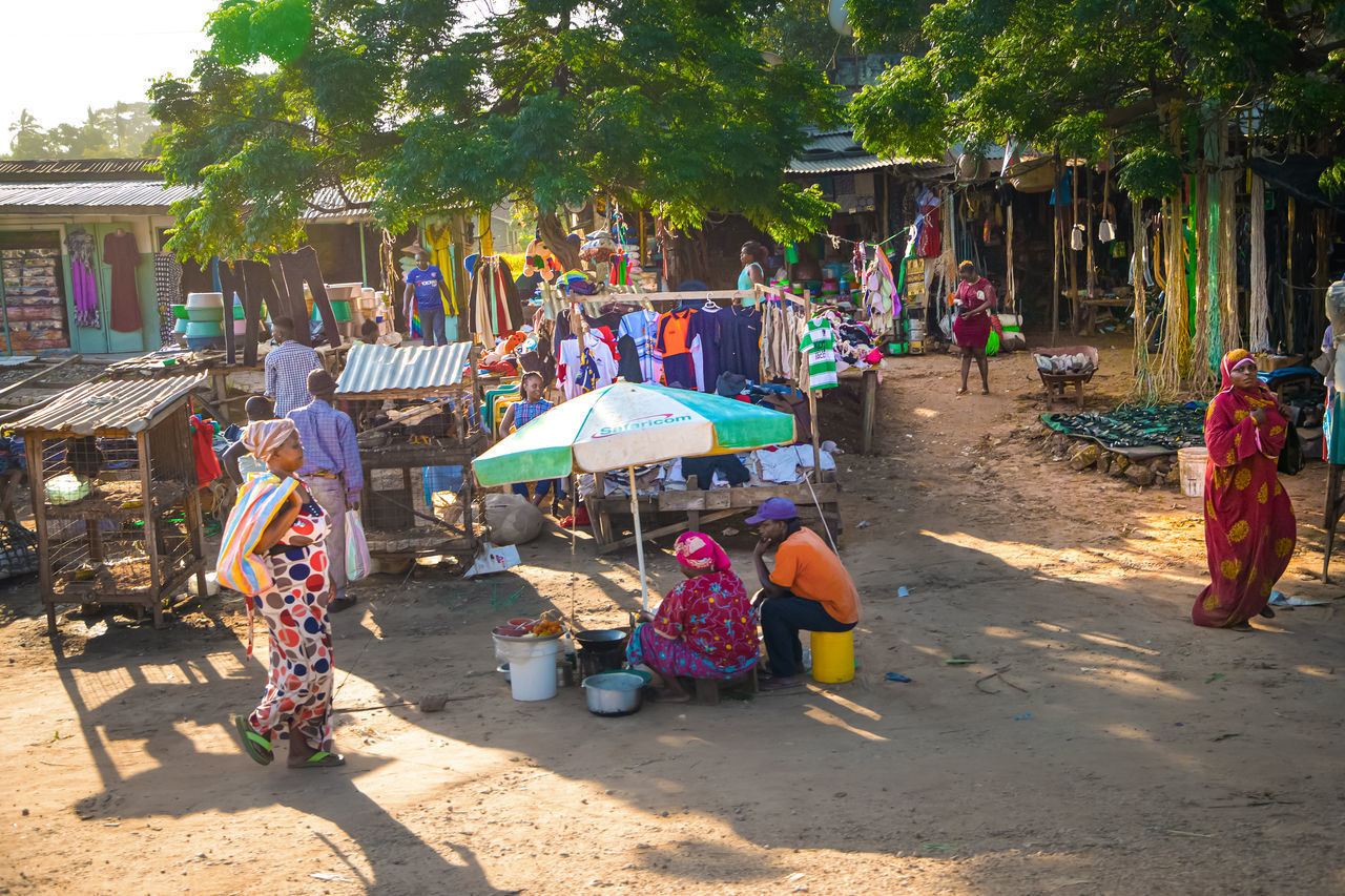 PEOPLE AT MARKET STALL