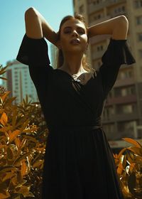 Young woman standing outdoors