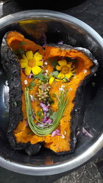 High angle view of yellow flowers in bowl