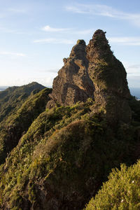 View of rocks on mountain against sky