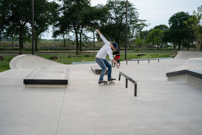 Full length of man skateboarding on skateboard