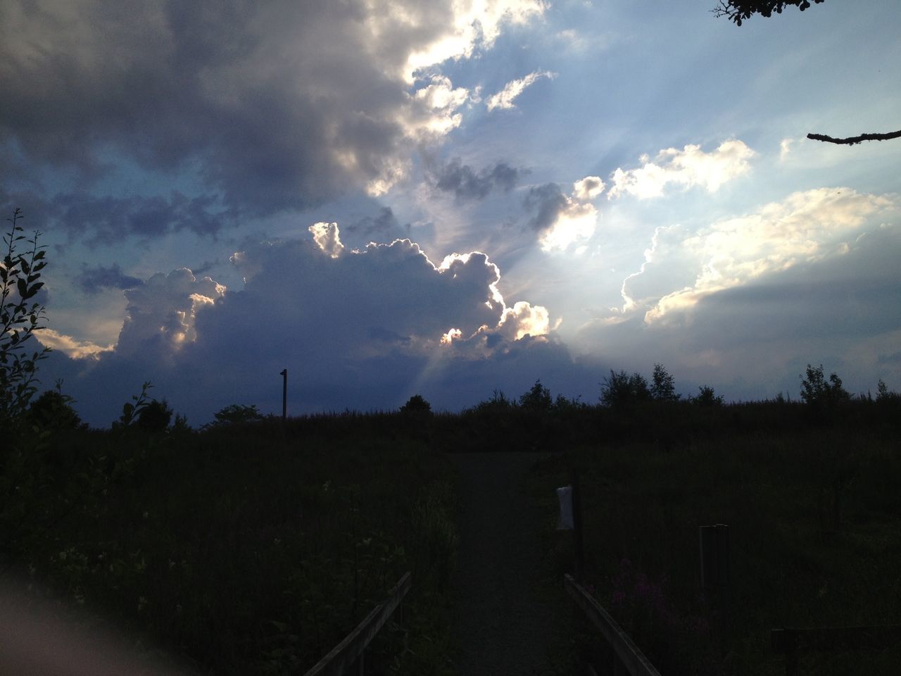 sky, cloud - sky, cloudy, transportation, cloud, silhouette, landscape, road, tree, tranquility, tranquil scene, nature, scenics, field, the way forward, beauty in nature, weather, dusk, mode of transport, outdoors