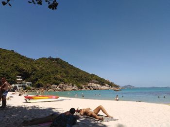 Scenic view of beach against clear blue sky