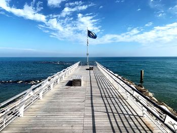 Pier over sea against sky