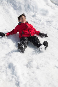 Portrait of boy having fun in the snow
