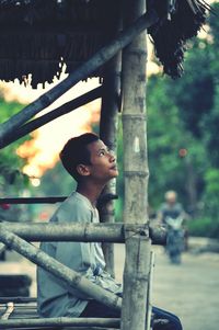 Thoughtful man sitting outdoors