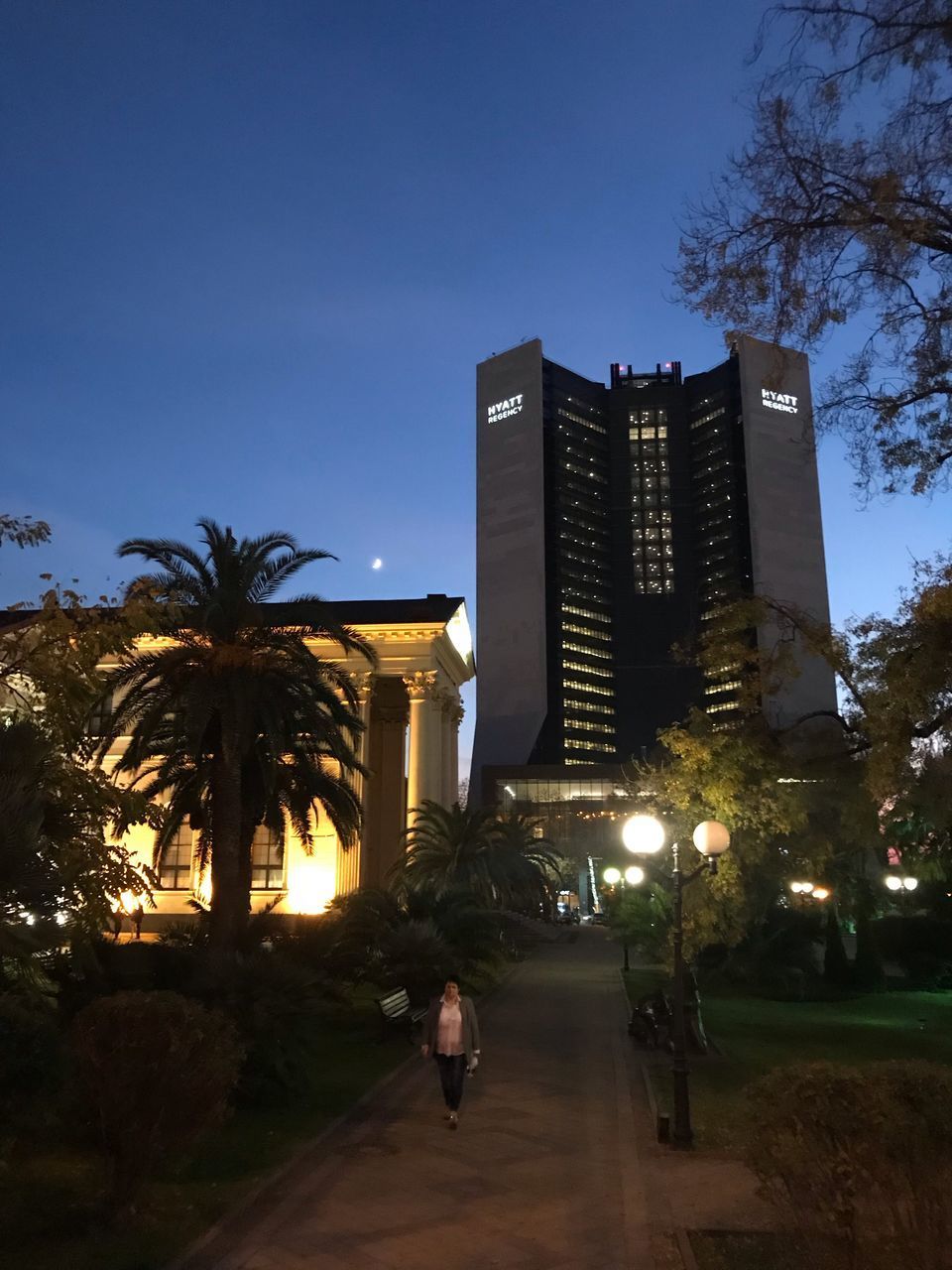 LOW ANGLE VIEW OF ILLUMINATED BUILDINGS AGAINST SKY