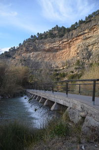 Scenic view of lake against cloudy sky