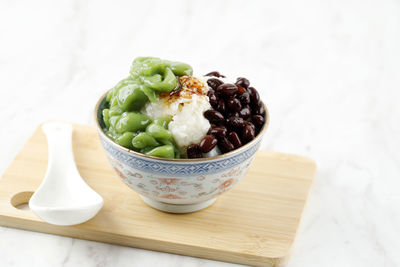 Malaysian desserts called cendol. made from crushed ice cubes, red bean, variety of sweets, fruits. 