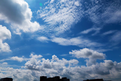 Low angle view of buildings against blue sky