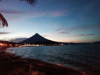 Scenic view of sea against sky at night