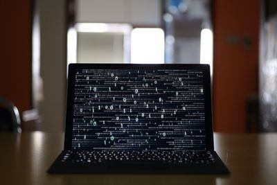 Close-up of laptop on table