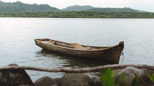 Boat moored on lake