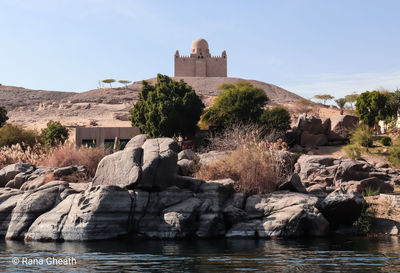 Castle on rock against sky