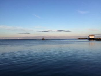 Scenic view of sea against blue sky