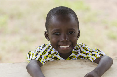 Close-up portrait of cute boy at table