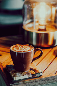 Close-up of coffee cup on table