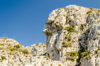 Anthropomorphic rock on the coastline near milazzo, italy