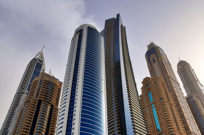 Low angle view of buildings in city against sky