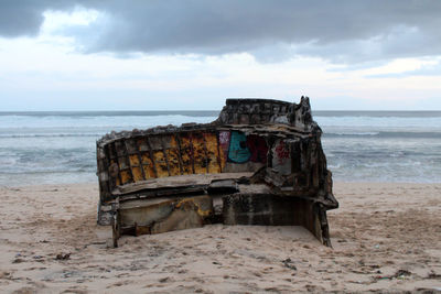 Abandoned boat on beach