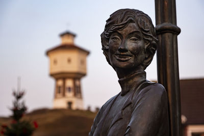 Statue of historic building against sky