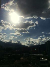 Scenic view of mountains against cloudy sky