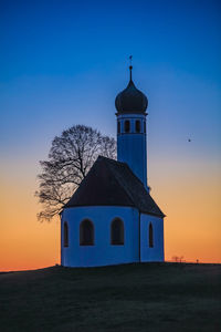 Building against sky during sunset