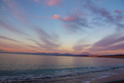 Scenic view of sea against romantic sky at sunset