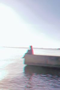 Boat in sea against clear sky