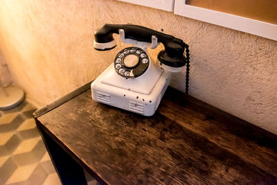 High angle view of telephone on table at home