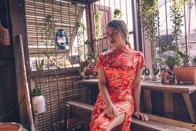 Woman standing by window