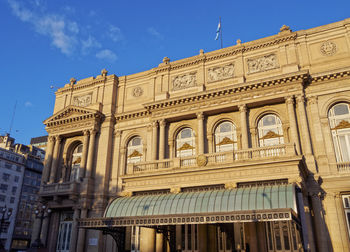 Low angle view of historical building against blue sky