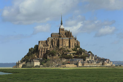 View of temple against cloudy sky