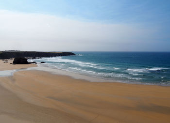 Scenic view of beach against sky