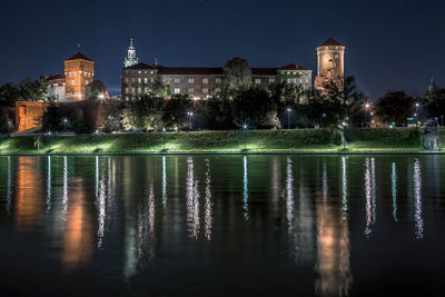 Wawel castle and vistula, wisla, river night panorama, krakow, poland