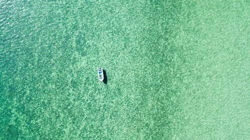 Directly above aerial view of boat on sea