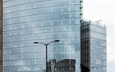 Low angle view of modern building against sky